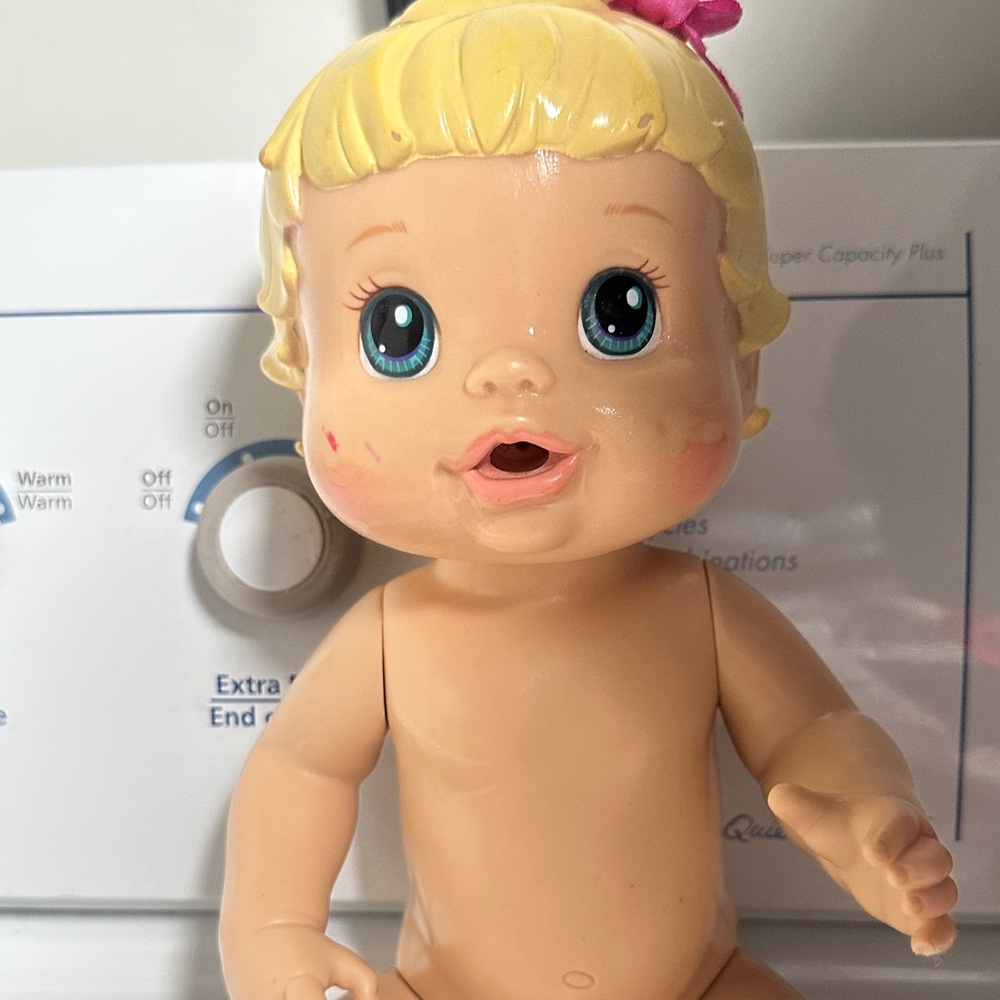 Charming Baby Doll with Blonde Hair and Blue Eyes